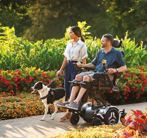 two people and a dog enjoying the outdoors